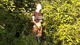 in a daring outdoor adventure, a brunette woman explores self-pleasure amidst nature, leading to an intense personal climax