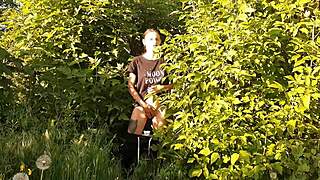 in a daring outdoor adventure, a brunette woman explores self-pleasure amidst nature, leading to an intense personal climax