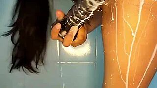 Hey, check out this horny Colombian babe using her dildo in the shower!