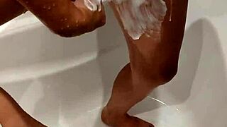 Milf gets naked in the shower, revealing big tits while bathing sensually in private moment.