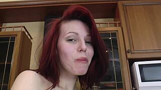 Redhead with big tits gives hot closeups