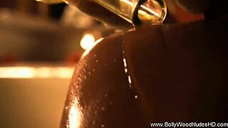 Sensual brunette babe from Bollywood dances erotically while teasing and undressing in nude striptease scene.