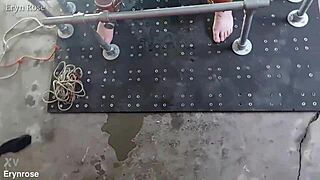 pretty submissive beauty gets bound in metal restraints during intense workout with toys leading to squirting orgasm