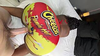 This white guy sneaks through a gloryhole to fuck a curvy black girl's big ass right in her tight yoga pants during an intense workout session.