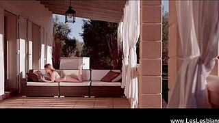 Beautiful lesbian lovers enjoy a sensual shower together with gentle kisses and erotic touches in the bathroom.