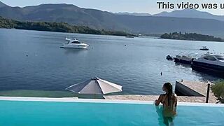 gorgeous monika fox with big tits and pierced nipples swims naked in pool at beautiful outdoor place