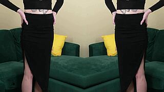 Young babe Kit Summers models two-piece black outfit with deep plunging neck in photoshoot