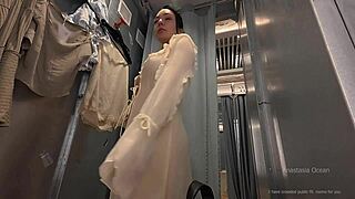 why am i trying on clothes in this open curtain fitting room while people pass and watch me naked?