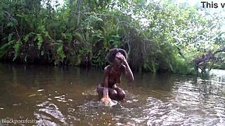 attractive african village girl enjoys peaceful river bathing outdoors