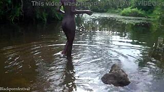 attractive african village girl enjoys peaceful river bathing outdoors