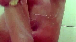 hot young woman in the shower getting waxed in the bathroom