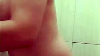 hot young woman in the shower getting waxed in the bathroom