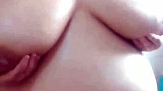 Milf plays with pussy in bathtub then sucks cock deep, rides on top, and gets cum over huge natural tits.