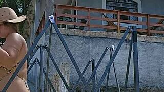 Setting up a tent on the farm while wearing a tight body outfit