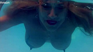 melissa the mermaid shows brown eyes and tattoo by the pool in milf solo scene