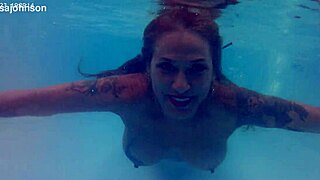 melissa the mermaid shows brown eyes and tattoo by the pool in milf solo scene