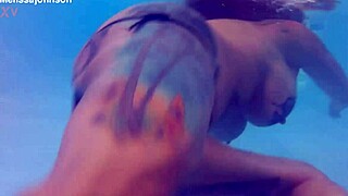 melissa the mermaid shows brown eyes and tattoo by the pool in milf solo scene