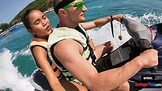 Oh man this Asian girlfriend is giving a blowjob in public on a jetski with her boyfriend.