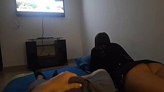 My roommate and I relax watching a movie alone at home until things turn playful.