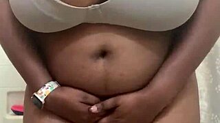 She shakes her natural big tits in a playful black outfit display