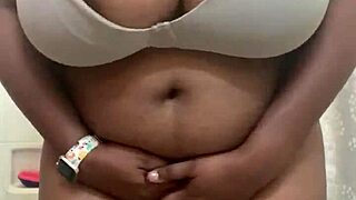 She shakes her natural big tits in a playful black outfit display