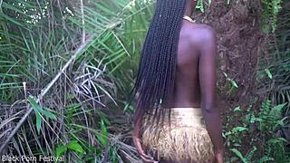 Why does this perfect body dark skin african girl dance half naked outdoors in the village forest?