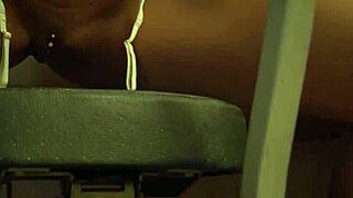 Check out this big boobed inked ebony beauty Harley Dean stripping to reveal her shaved pierced pussy