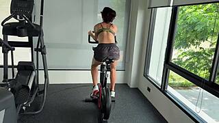 brunette fitness babe with muscular body and small tits poses in gym workout photoshoot.