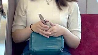 Chinese babe flashes panties on crowded train.