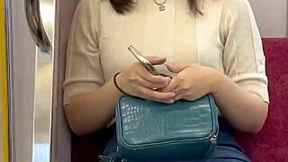 Chinese babe flashes panties on crowded train.