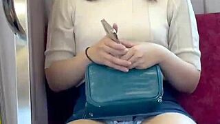 Chinese babe flashes panties on crowded train.