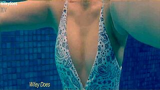 Wife swims leisurely in hotel pool wearing sleek one-piece swimsuit preview