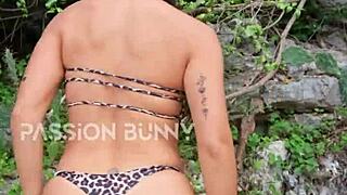 Hey, watch this cute bikini girl dance and finger outdoors!