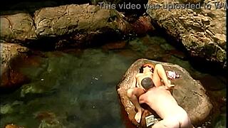 Mature stud pounds exotic babe's pussy cowgirl on seaside rocks