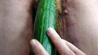 German granny stuffs hairy pussy with cucumber toy