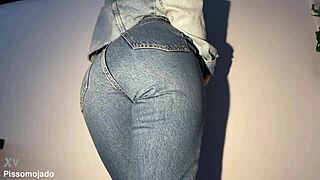 Petite latina desperately pees soaking her tight jeans closeup