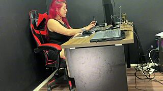 She almost gets caught playing with her big black cock dildo at the office desk