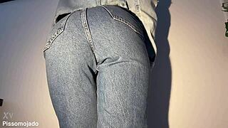 Petite latina desperately pees soaking her tight jeans closeup