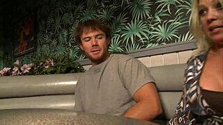 Busty Blonde Fills Shaved Pussy with Cock in Restaurant Booth