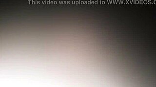 Blonde model in pink blouse poses seductively for me