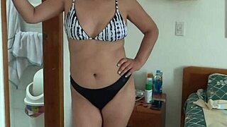 beautiful stepmom on beach slips into bikini flashing her big tits and ass for strangers