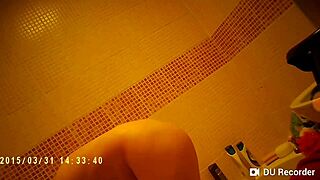 spy cam catches shower babe with nude tits
