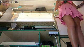 woman in pink skirt caught on hidden upskirt cam at work