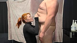 A chubby guy gets belly kisses from fiery redhead before her sloppy blowjob and facial blast