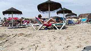 huge titted brunette teases amateurs beach flaunt part 2!