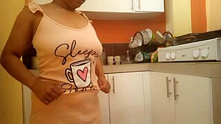 busty babe fingers her big ass in kitchen