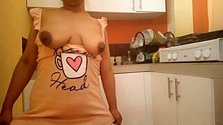 busty babe fingers her big ass in kitchen