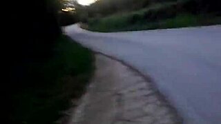 Why risk flashing naked by the car on this public road?