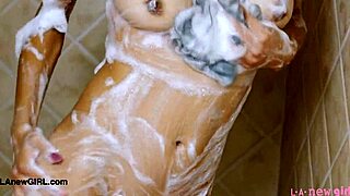 GIRL NEXT-DOOR MODEL STRIPS DOWN FOR STEAMY SHOWER FUN!