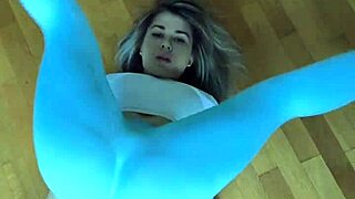 petite athlete stretches her toned body in tight leggings workout